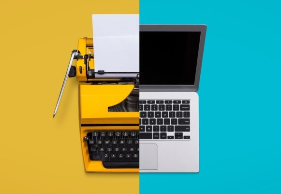 letting go of old technology - typewriter and laptop
